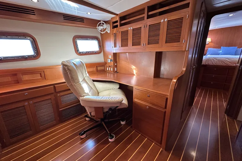 Slide: The Image of Luxurious wooden interior of 2017 Kadey-Krogen 58EB yacht with desk and chair. - 31