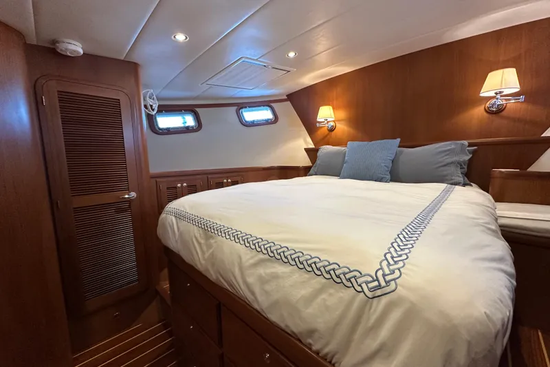 Slide: The Image of Luxurious cabin interior of 2017 Kadey-Krogen 58EB yacht with cozy bed and wooden finish. - 37