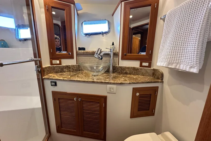 Slide: The Image of Luxurious 2017 Kadey-Krogen 58EB yacht bathroom with marble countertop and glass sink. - 40