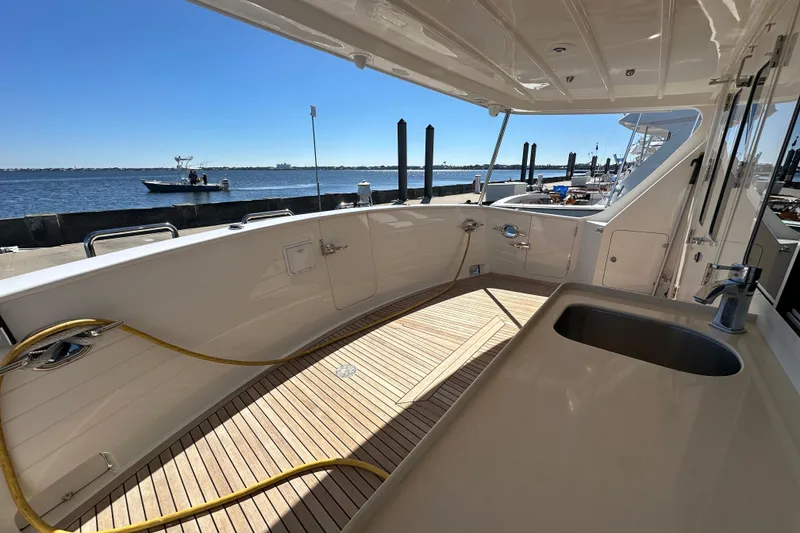 Slide: The Image of 2017 Kadey-Krogen 58EB yacht deck with sink, docked by the water. - 48