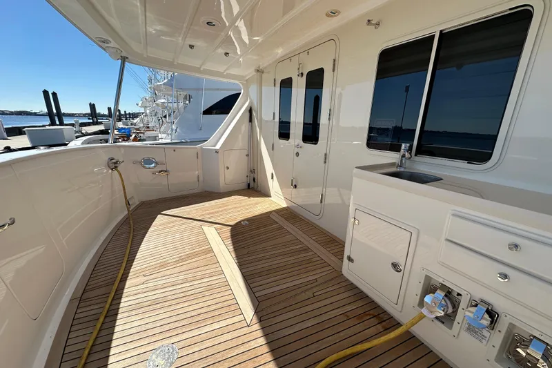 Slide: The Image of Spacious deck of 2017 Kadey-Krogen 58EB yacht with teak flooring and utility area. - 49