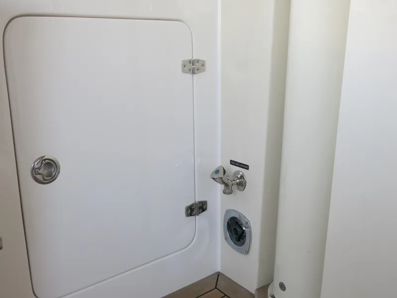 Slide: The Image of 2017 Kadey-Krogen 58EB yacht compartment door with latch and fittings. - 54