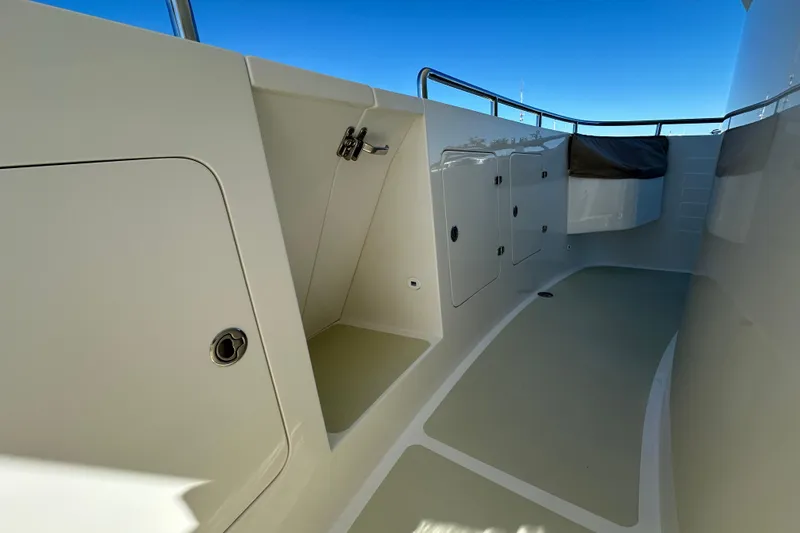 Slide: The Image of 2017 Kadey-Krogen 58EB yacht deck with storage compartments and railing. - 59
