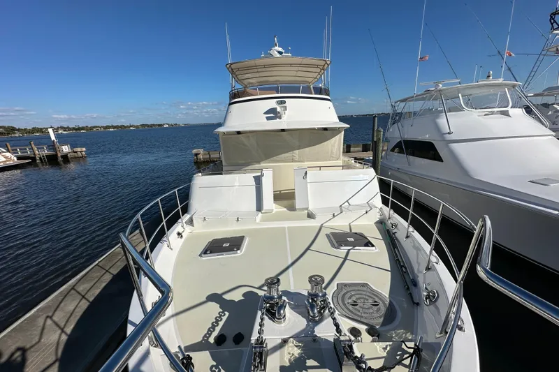 Slide: The Image of 2017 Kadey-Krogen 58EB yacht docked at marina under clear blue sky. - 61