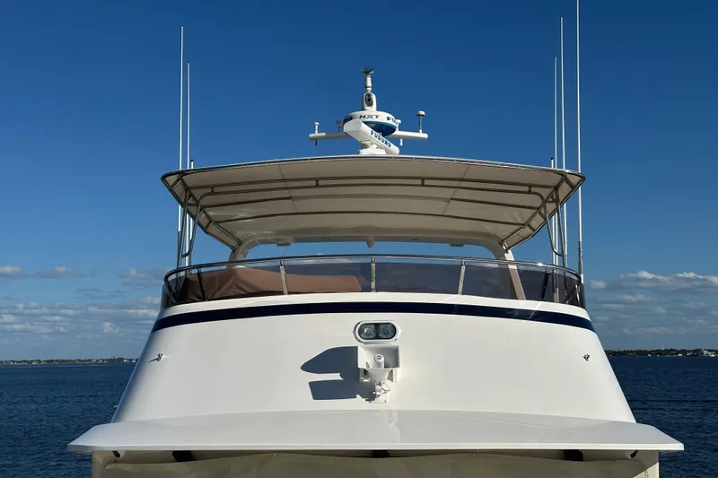 Slide: The Image of 2017 Kadey-Krogen 58EB yacht front view on calm blue water. - 63