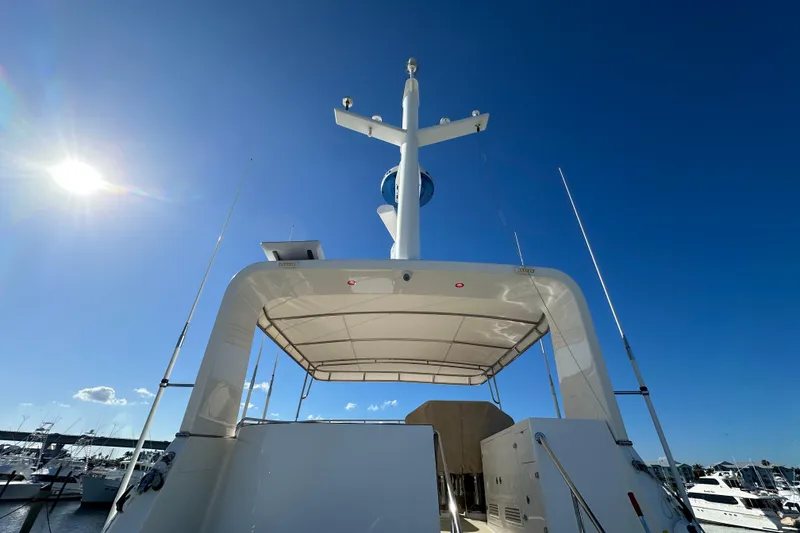 Slide: The Image of 2017 Kadey-Krogen 58EB yacht deck under clear blue sky. - 64