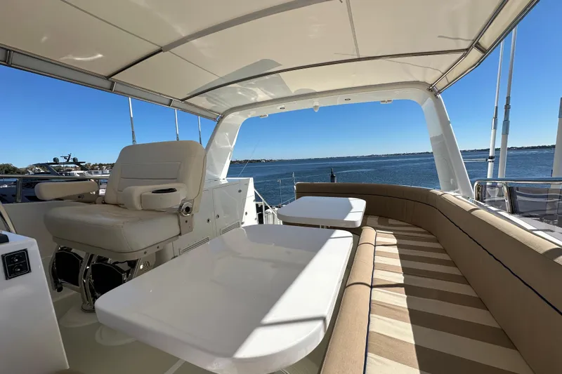Slide: The Image of Luxurious 2017 Kadey-Krogen 58EB yacht deck with seating and ocean view. - 67