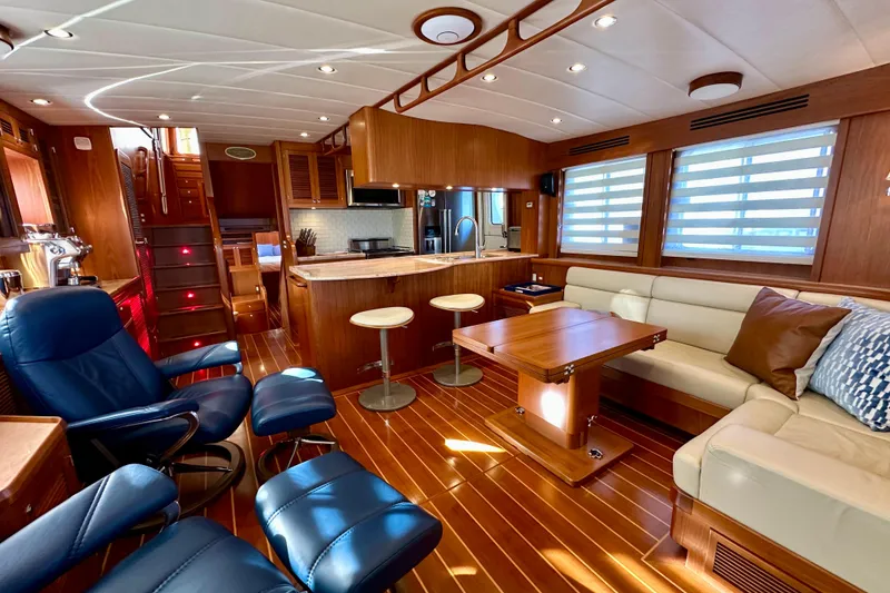 Slide: The Image of Luxurious 2017 Kadey-Krogen 58EB yacht interior with elegant wood finishes and modern furnishings. - 7