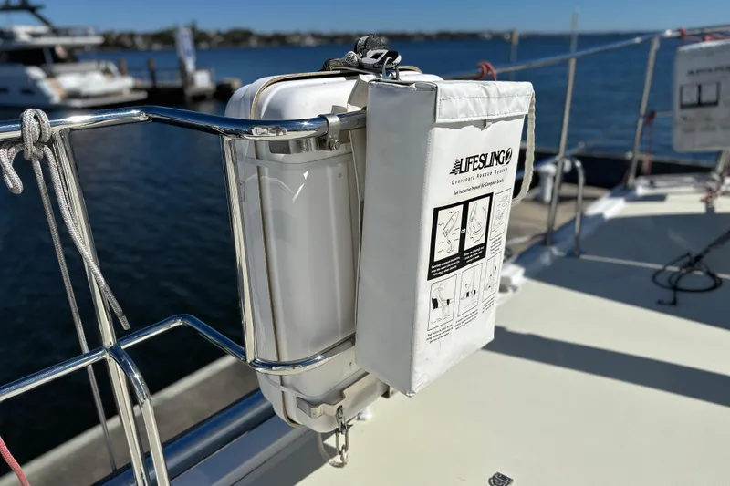 Slide: The Image of Lifesling rescue system on 2017 Kadey-Krogen 58EB yacht, docked by the water. - 76