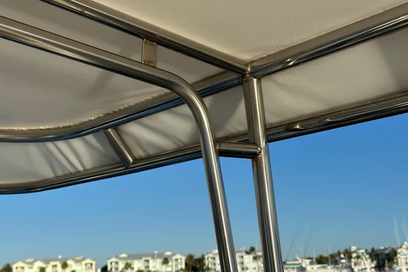 Slide: The Image of Stainless steel frame of 2017 Kadey-Krogen 58EB yacht against clear blue sky. - 79