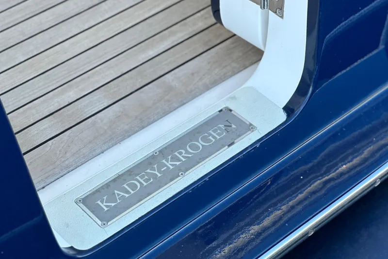 Slide: The Image of Kadey-Krogen 58EB 2017 yacht entrance with wooden deck and nameplate. - 85