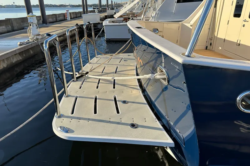 Slide: The Image of Kadey-Krogen 58EB 2017 yacht with extended swim platform at marina. - 86