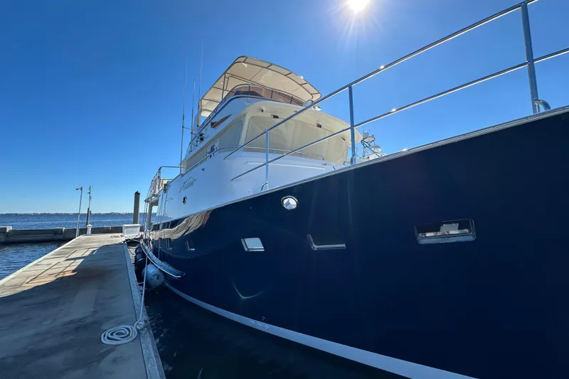Slide: The Image of 2017 Kadey-Krogen 58EB yacht docked under clear blue sky. - 89