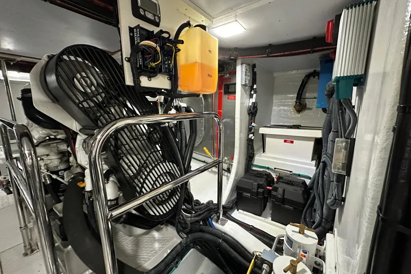 Slide: The Image of Engine room of 2017 Kadey-Krogen 58EB yacht, featuring mechanical and electrical components. - 90