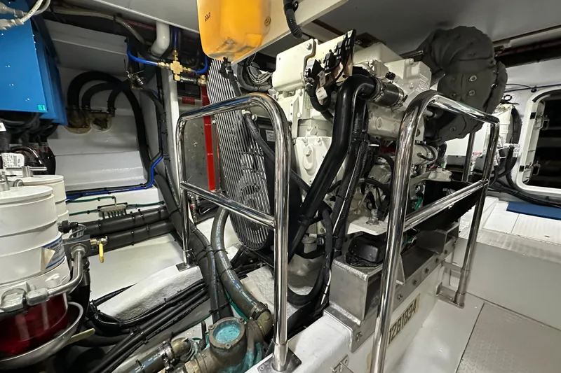 Slide: The Image of Engine room of 2017 Kadey-Krogen 58EB yacht, featuring complex machinery and piping. - 91