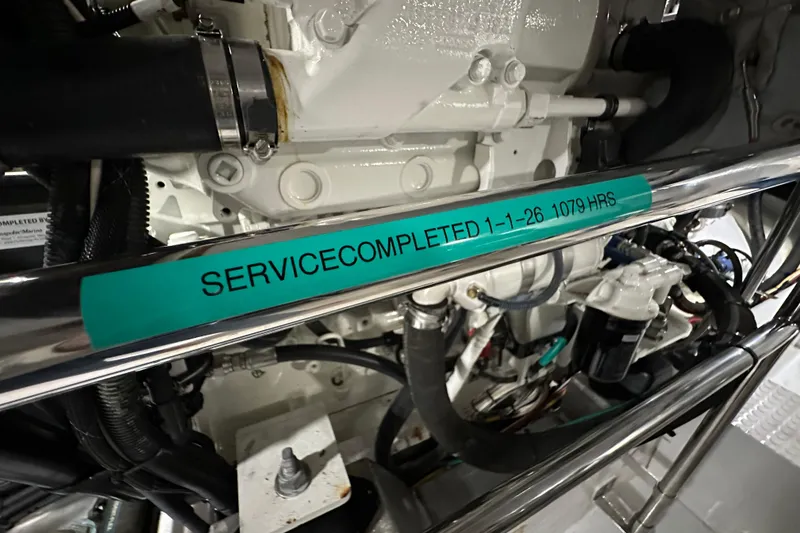 Slide: The Image of Engine room of 2017 Kadey-Krogen 58EB with service completion label. - 92