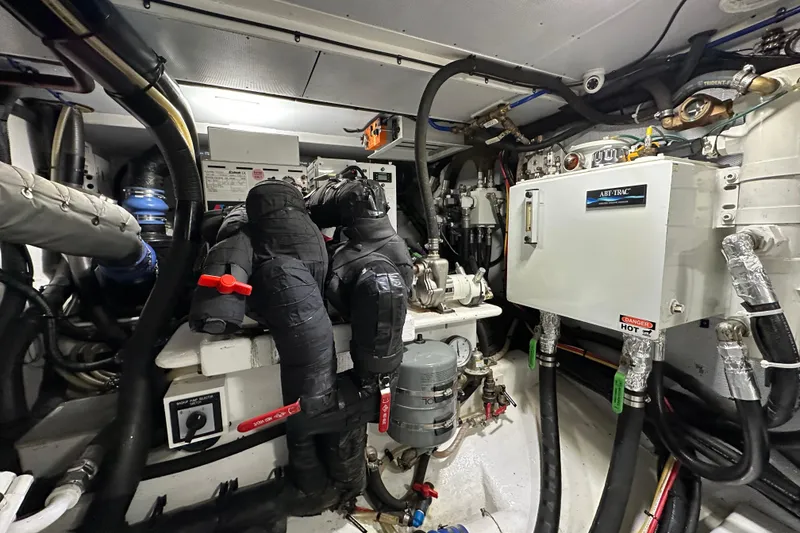 Slide: The Image of Engine room of 2017 Kadey-Krogen 58EB yacht with complex machinery and piping. - 94