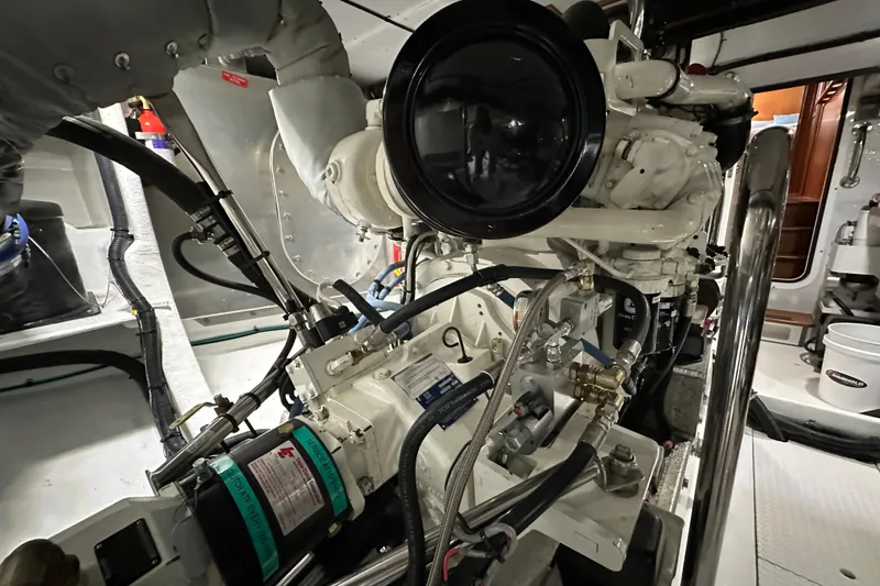 Slide: The Image of Engine room of 2017 Kadey-Krogen 58EB yacht, showcasing detailed mechanical components. - 97