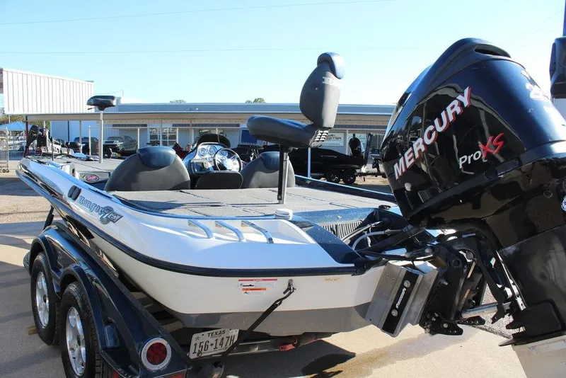 Slide: The Image of 2007 Ranger Z20 Comanche boat with Mercury Pro XS engine, parked outdoors. - 10