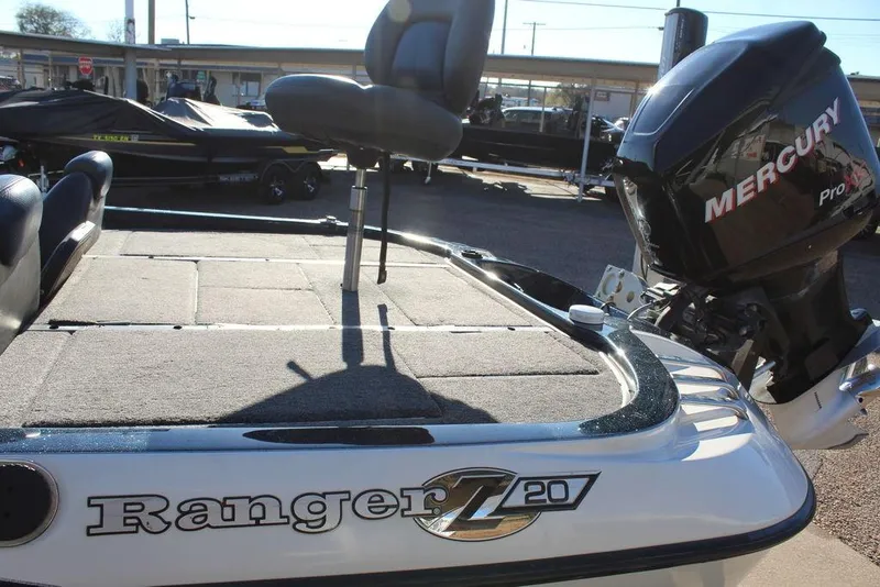 Slide: The Image of 2007 Ranger Z20 Comanche boat with Mercury Pro XS engine, featuring spacious deck and seating. - 6