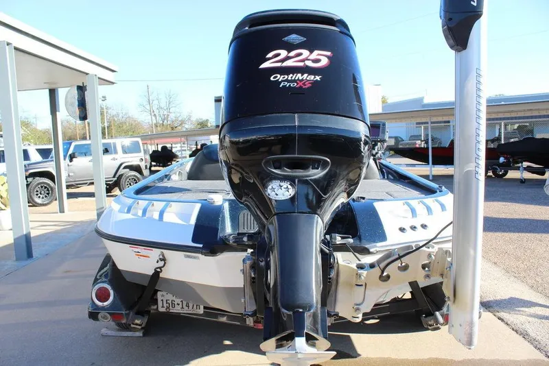 Slide: The Image of 2007 Ranger Z20 Comanche boat with OptiMax Pro XS 225 engine, parked outdoors. - 7
