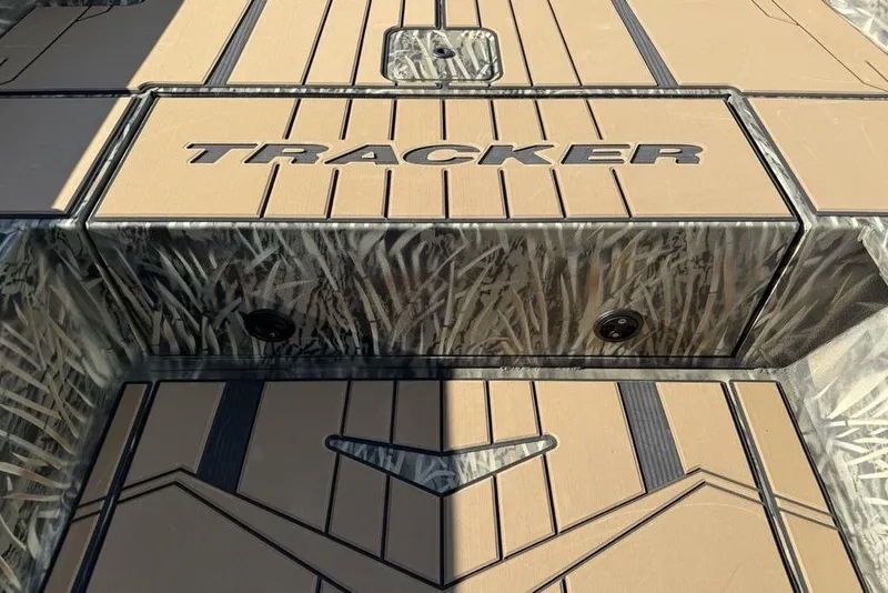 Slide: The Image of 2026 Tracker Grizzly 1756 T Marsh boat deck with camo design and logo. - 12
