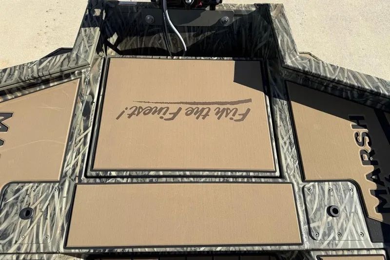 Slide: The Image of 2026 Tracker Grizzly 1756 T Marsh boat deck with camouflage design and "Flat Flock" text. - 22