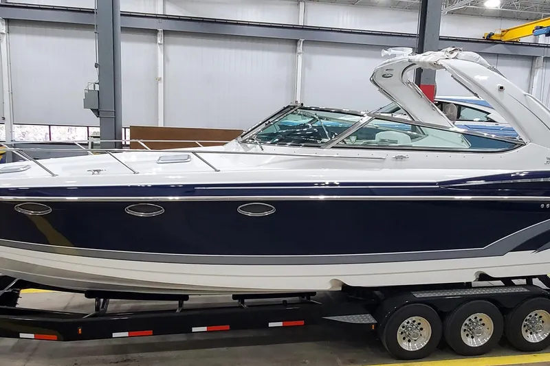 The Image of 2016 Formula 370 Super Sport boat on trailer in indoor facility. - 0