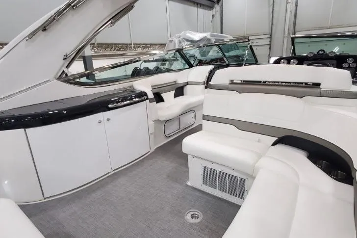 Slide: The Image of 2016 Formula 370 Super Sport boat interior with white seating and modern design. - 11