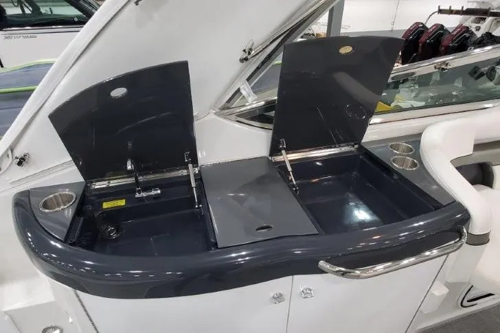 Slide: The Image of 2016 Formula 370 Super Sport boat interior with dual sinks and storage compartments. - 13