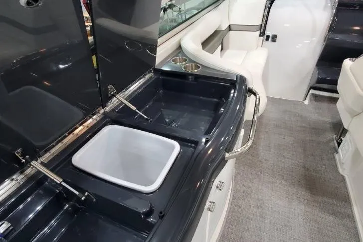 Slide: The Image of 2016 Formula 370 Super Sport boat interior with sink and seating area. - 14