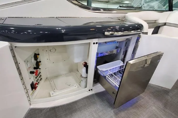 Slide: The Image of 2016 Formula 370 Super Sport yacht interior with open storage and mini fridge. - 15