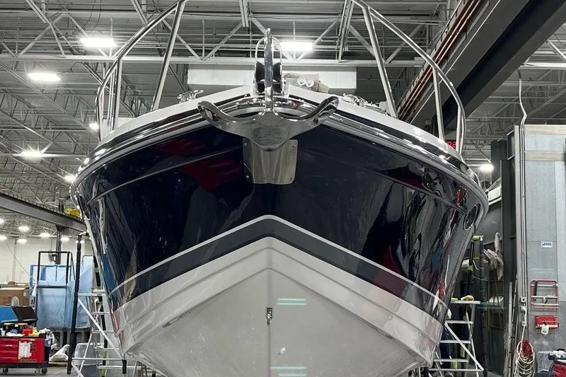 Slide: The Image of 2016 Formula 370 Super Sport boat in a workshop, front view. - 2