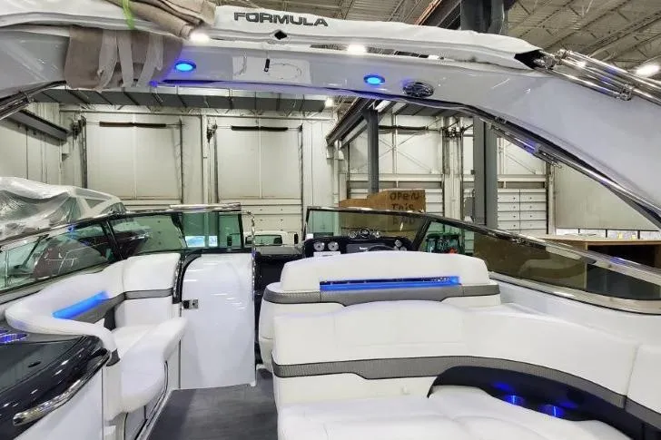 Slide: The Image of 2016 Formula 370 Super Sport boat interior with white seating and blue LED lighting. - 23
