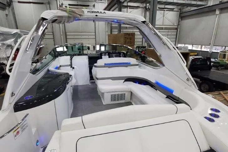 Slide: The Image of 2016 Formula 370 Super Sport boat interior with white seating and modern design. - 29