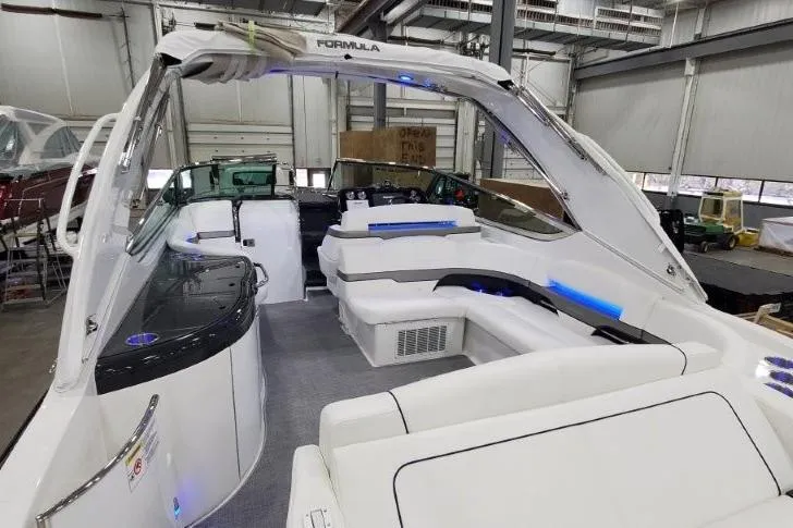 Slide: The Image of 2016 Formula 370 Super Sport boat interior with white seating and modern design. - 30