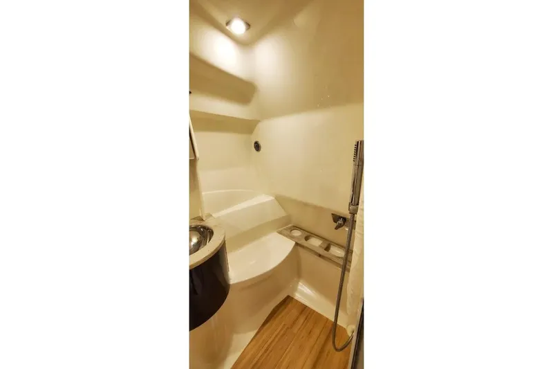 Slide: The Image of 2016 Formula 370 Super Sport bathroom with modern fixtures and wooden flooring. - 32