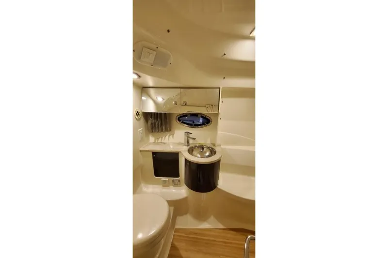 Slide: The Image of 2016 Formula 370 Super Sport boat bathroom interior with sink and mirror. - 33