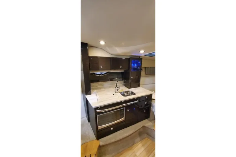 Slide: The Image of Interior of 2016 Formula 370 Super Sport yacht kitchen with modern amenities. - 41