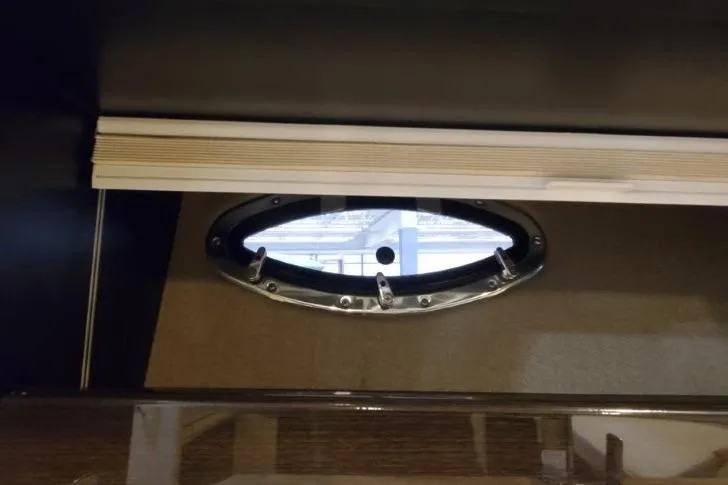 Slide: The Image of Porthole window inside 2016 Formula 370 Super Sport boat cabin. - 43