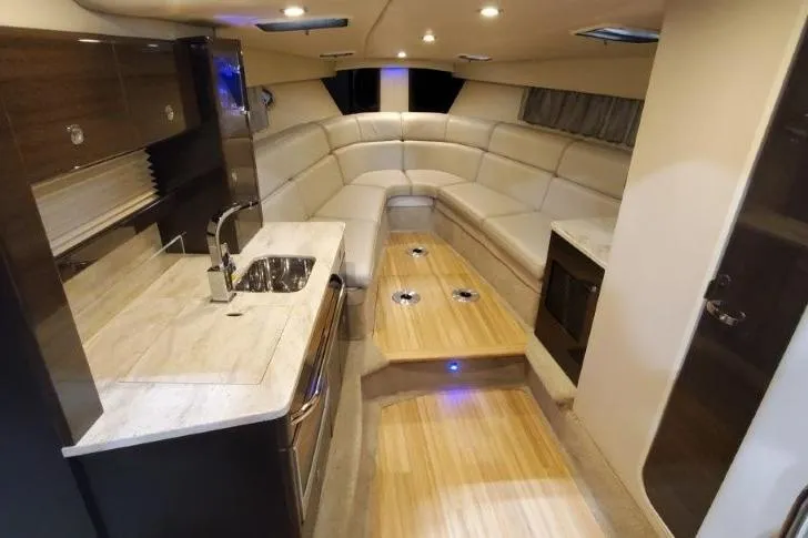 Slide: The Image of 2016 Formula 370 Super Sport interior with modern kitchen and luxurious seating. - 48