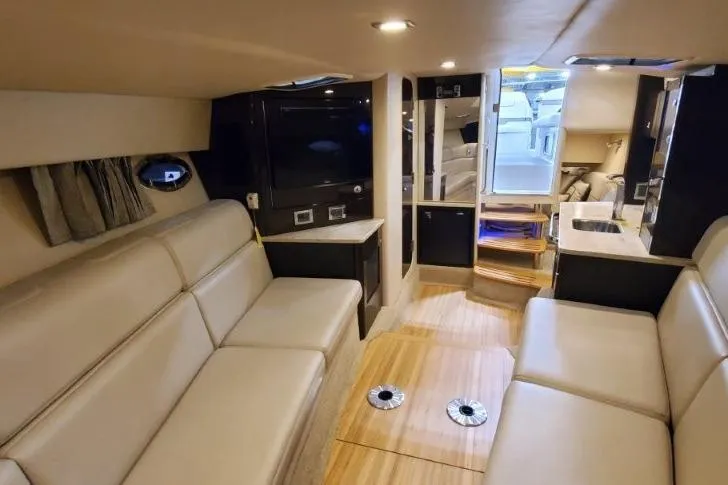 Slide: The Image of Luxurious interior of a 2016 Formula 370 Super Sport yacht with beige seating and modern amenities. - 52