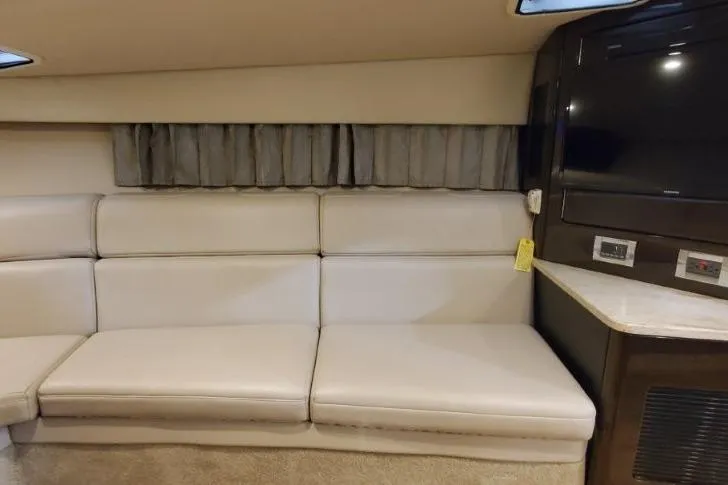 Slide: The Image of Interior of 2016 Formula 370 Super Sport yacht with beige seating and entertainment area. - 53