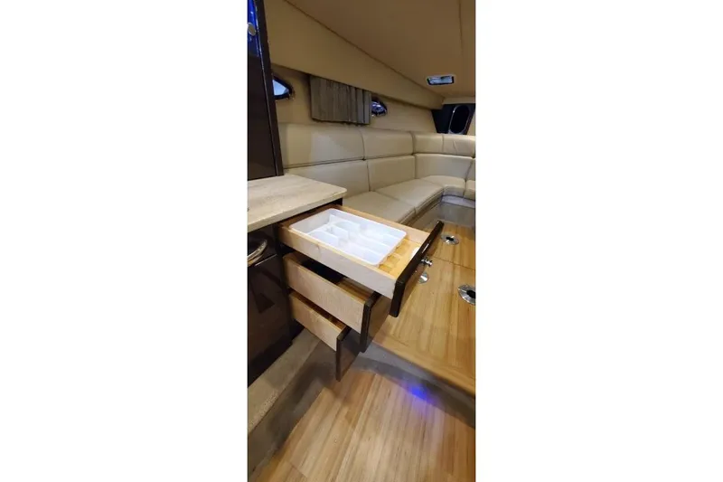 Slide: The Image of Interior of 2016 Formula 370 Super Sport with open drawer and beige seating. - 58