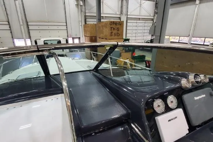 Slide: The Image of 2016 Formula 370 Super Sport boat dashboard in a warehouse setting. - 59