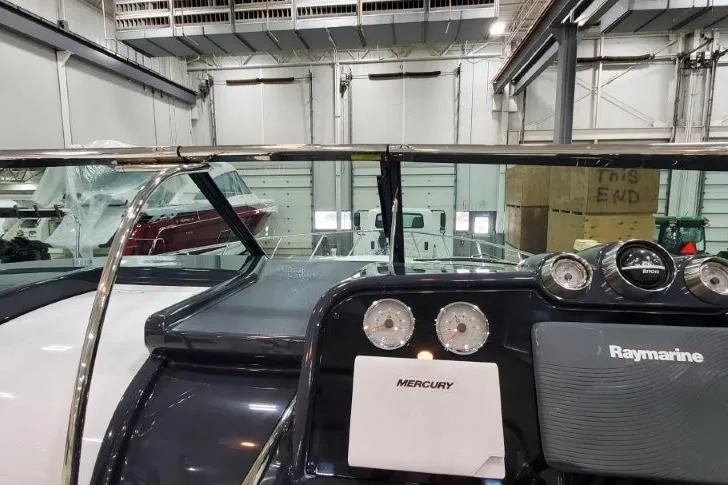 Slide: The Image of 2016 Formula 370 Super Sport boat dashboard with Mercury and Raymarine equipment in a showroom. - 60