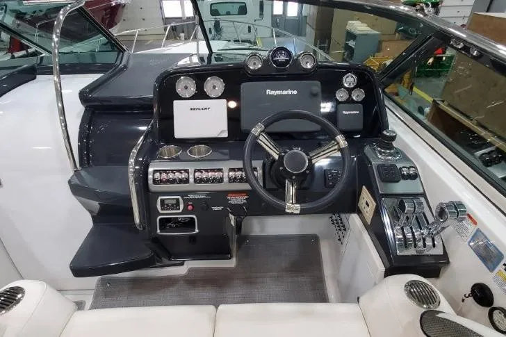 Slide: The Image of 2016 Formula 370 Super Sport boat dashboard with advanced navigation controls and instruments. - 62