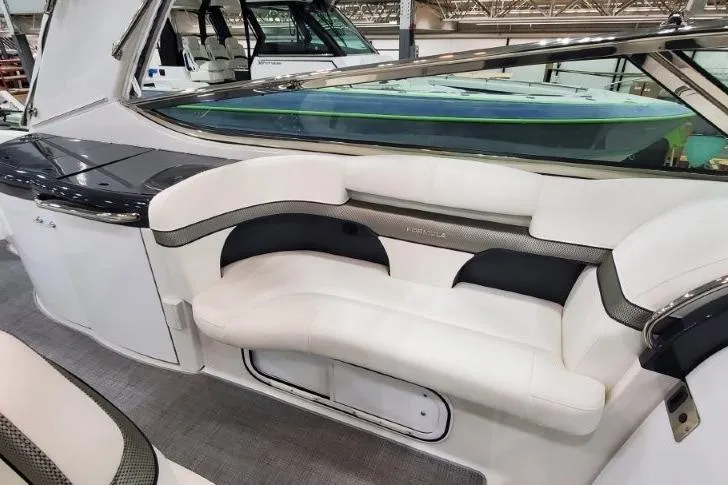Slide: The Image of 2016 Formula 370 Super Sport boat interior with white and black seating. - 64