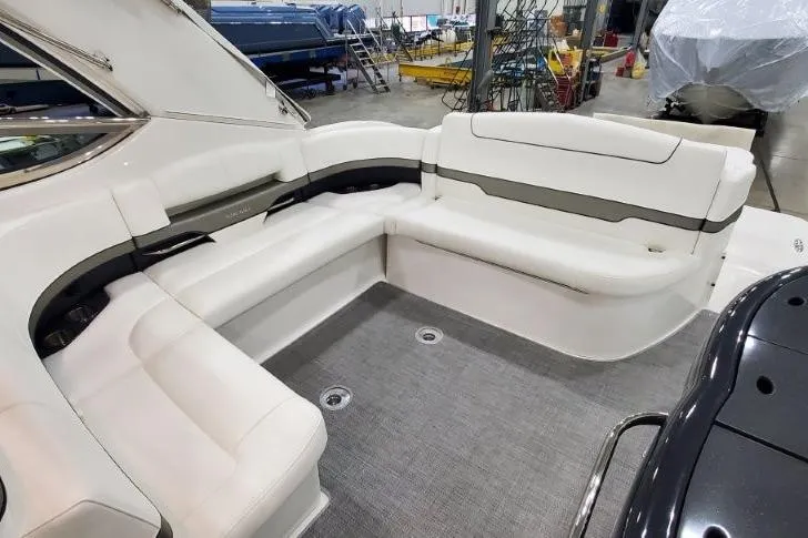 Slide: The Image of 2016 Formula 370 Super Sport boat interior with white seating in a showroom. - 66