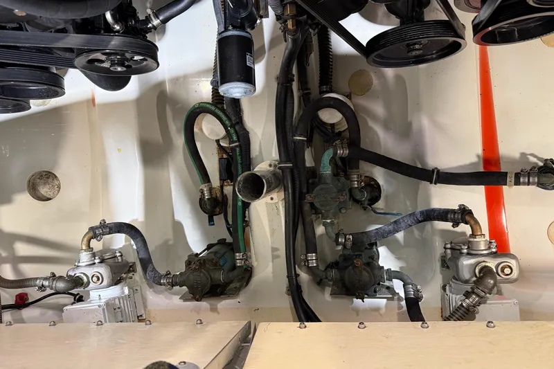 Slide: The Image of Engine compartment of a 2016 Formula 370 Super Sport boat, showcasing mechanical components. - 69